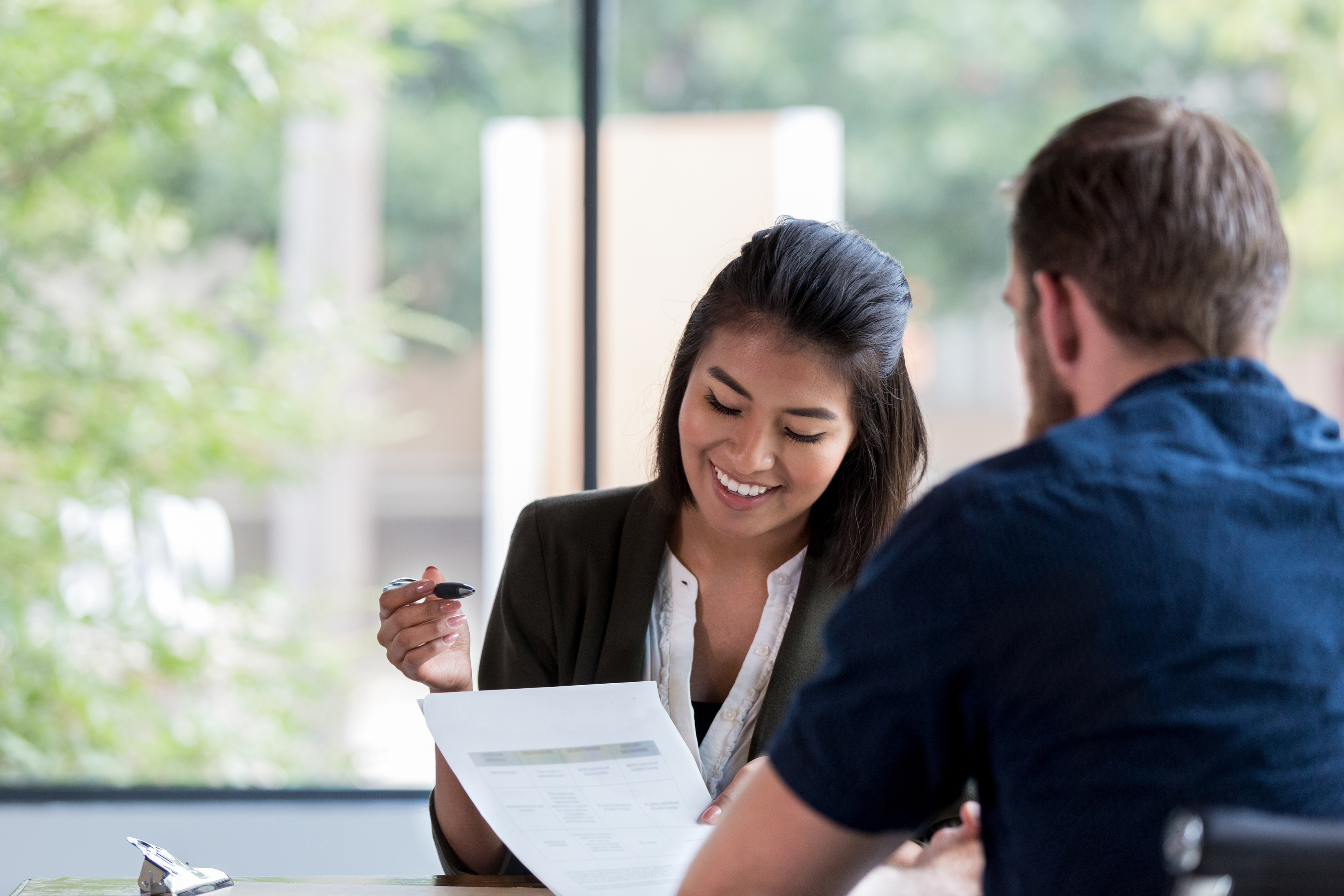 Finance adviser speaking with a client